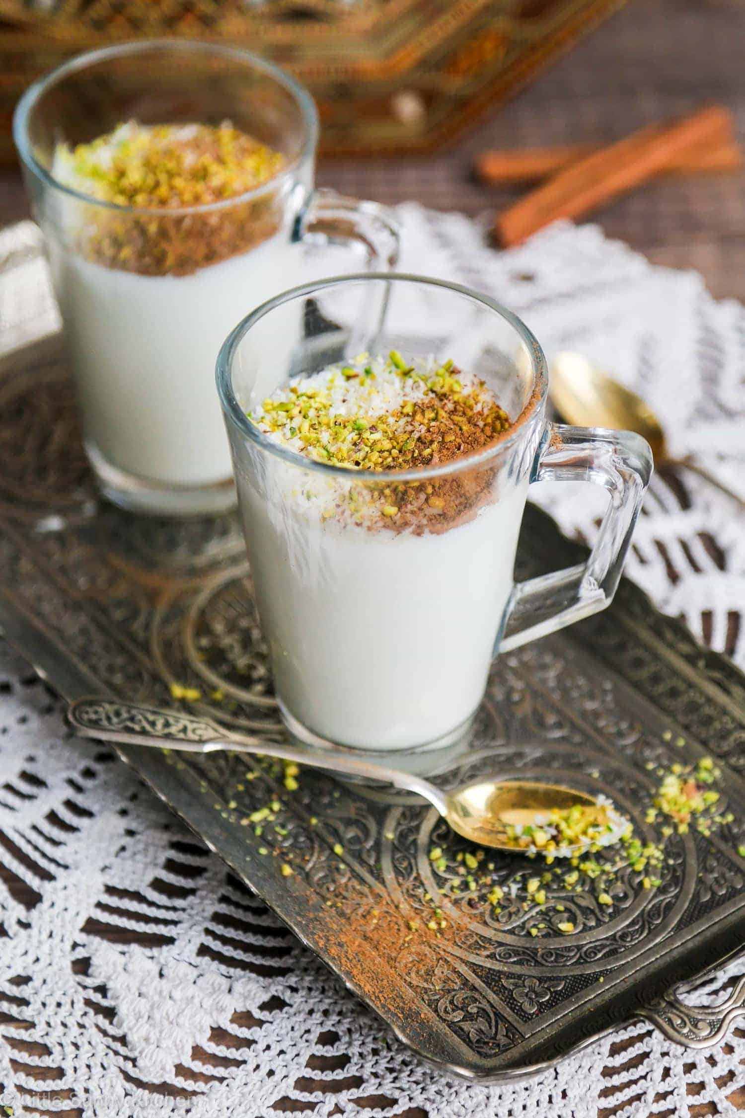 2 glass cups of Sahlab topped with cinnamon and crushed nuts