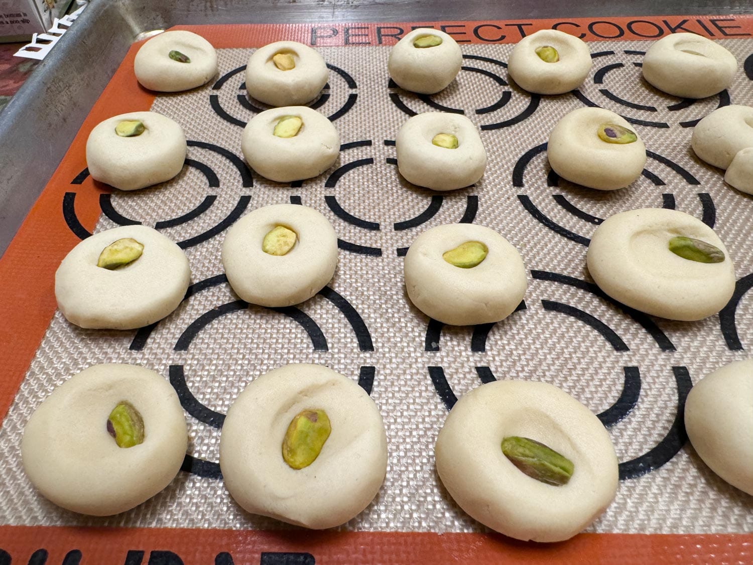 Ghraybeh cookies on a cookie sheet before baking