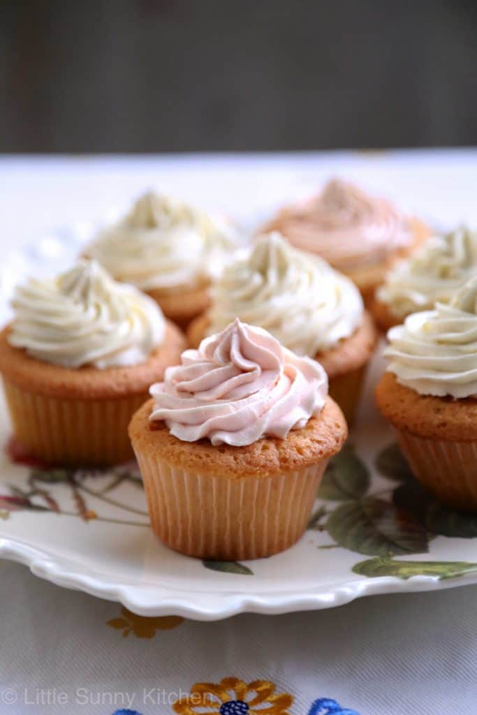 Jam filled cupcakes frosted with silky vanilla frosting