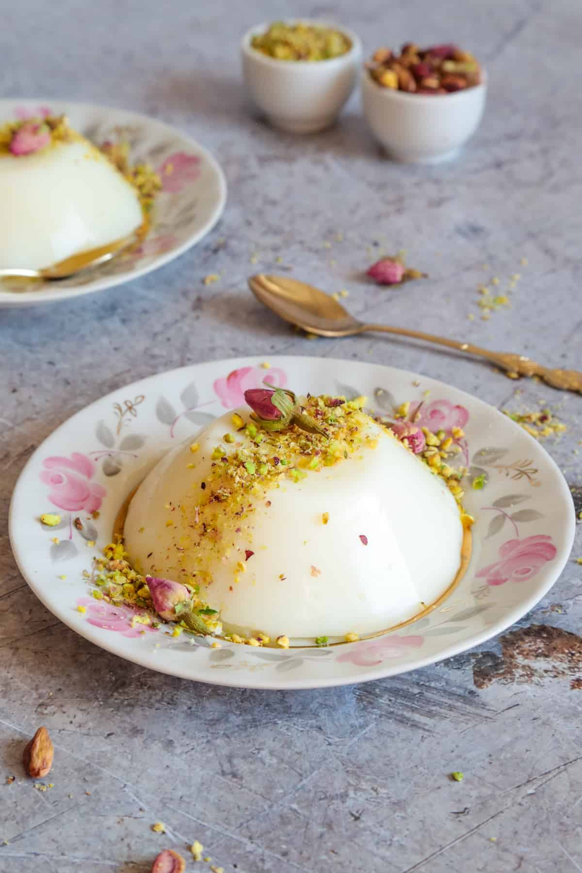 An incredible and creamy Middle Eastern milk pudding infused with rose water, and topped with crushed pistachios. 