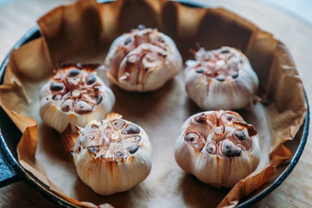 roasting garlic cloves to make roasted garlic soup 