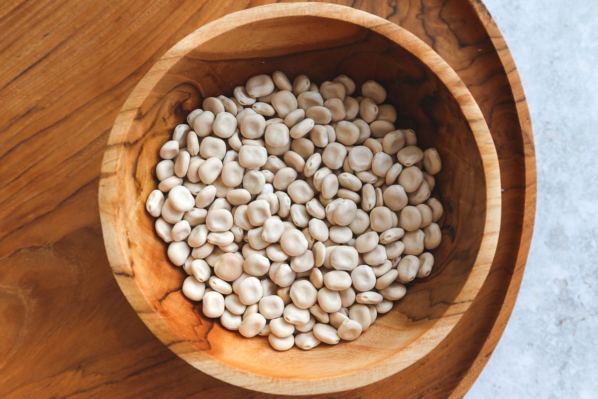 dried lupini beans in a wooden bowl