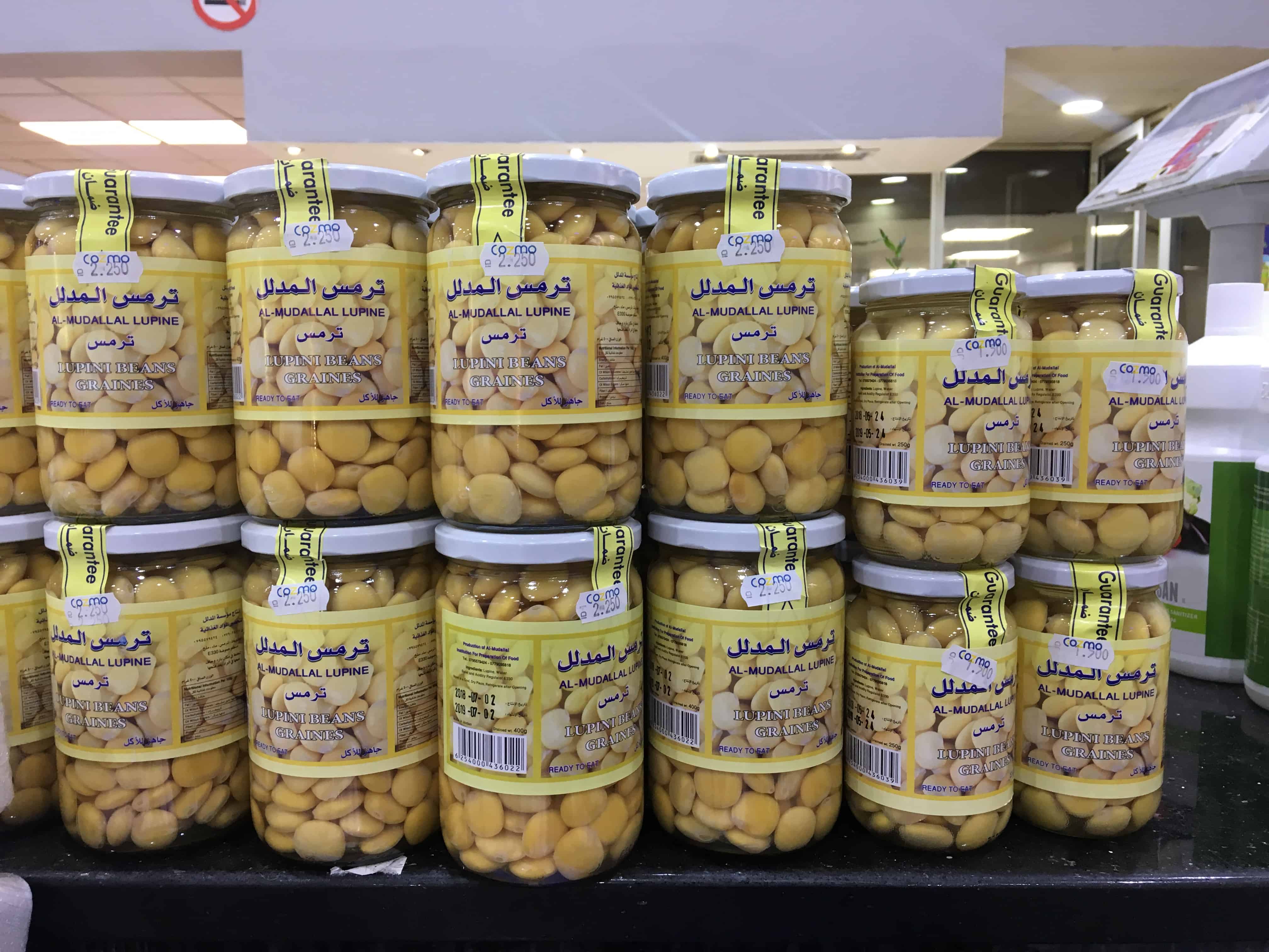 Jarred lupini beans in brine sold in Cozmo supermarket in Amman, Jordan. 