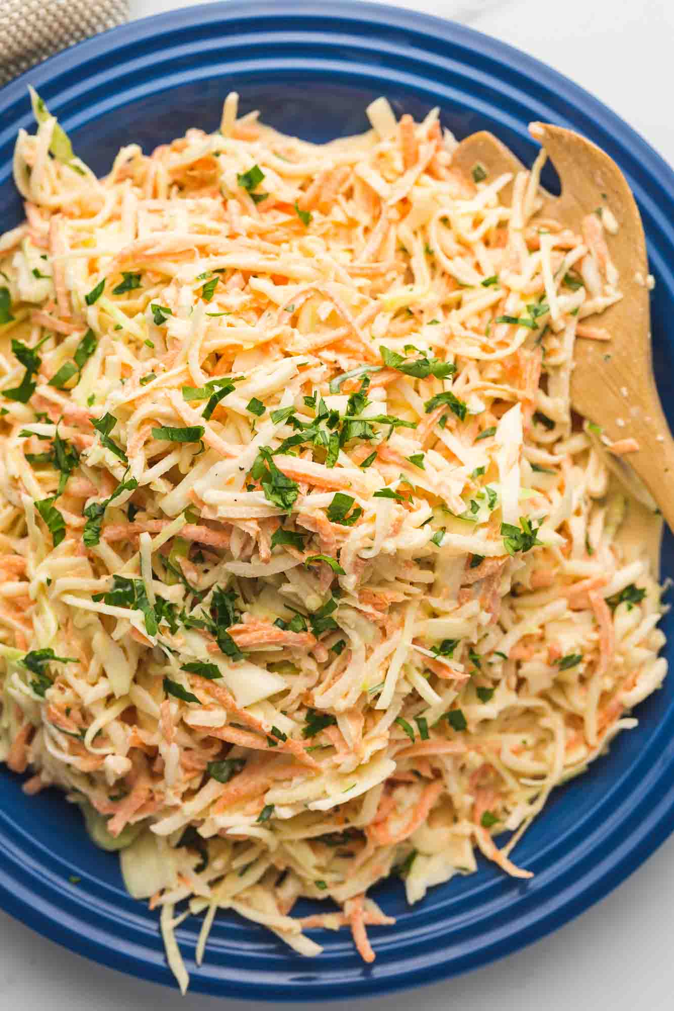 Overhead shot of daikon radish slaw served in a navy platter