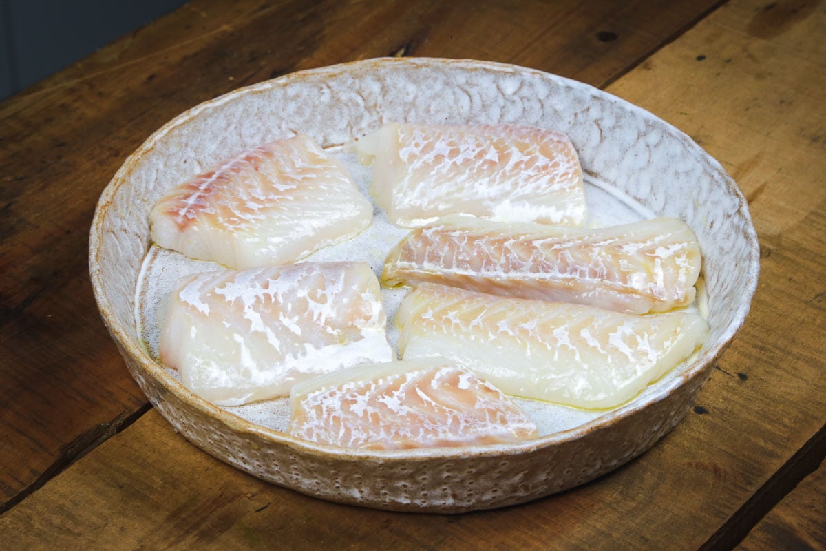 Fish fillets in a large bowl