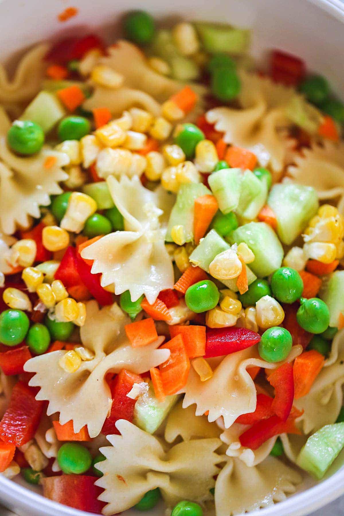 A close up shot of the pasta salad to show the ingredients
