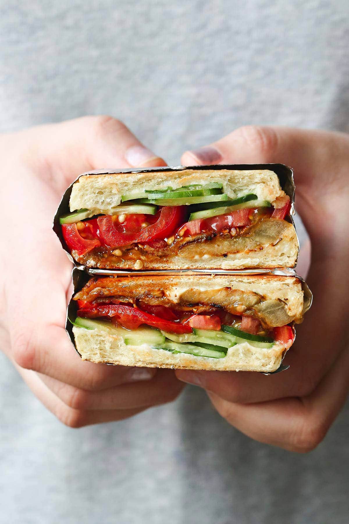 Girl holding the sandwich in her hands