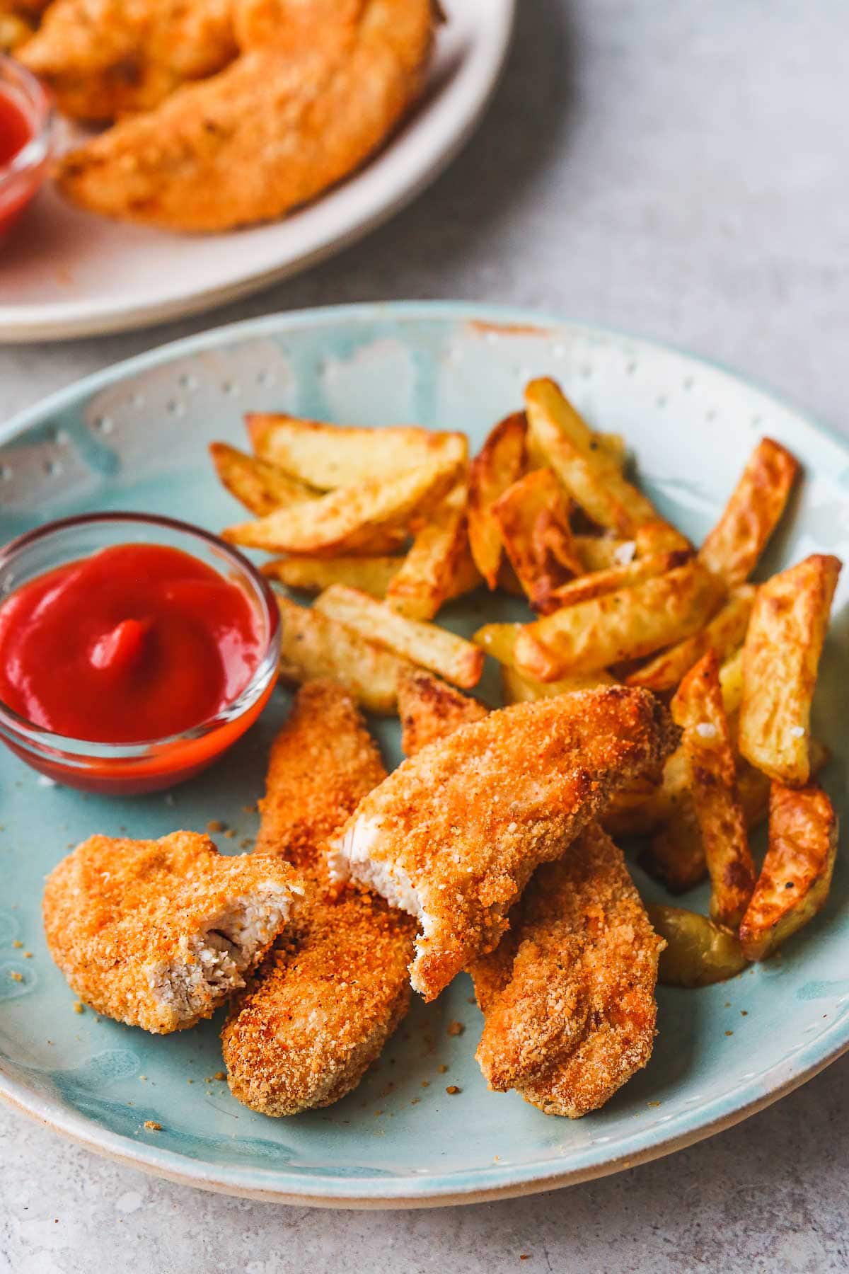 Air fryer chicken tenders with French fries