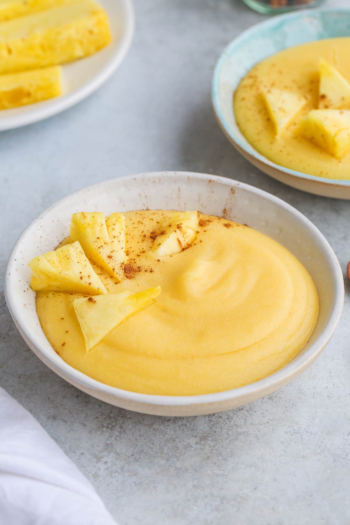 Cornmeal Porridge in a bowl, with a sprinkle of ground cinnamon