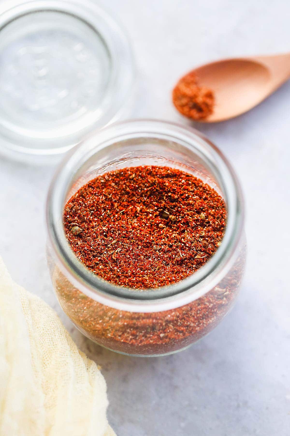 A small weck jar of Homemade Fajita Seasoning on a white background