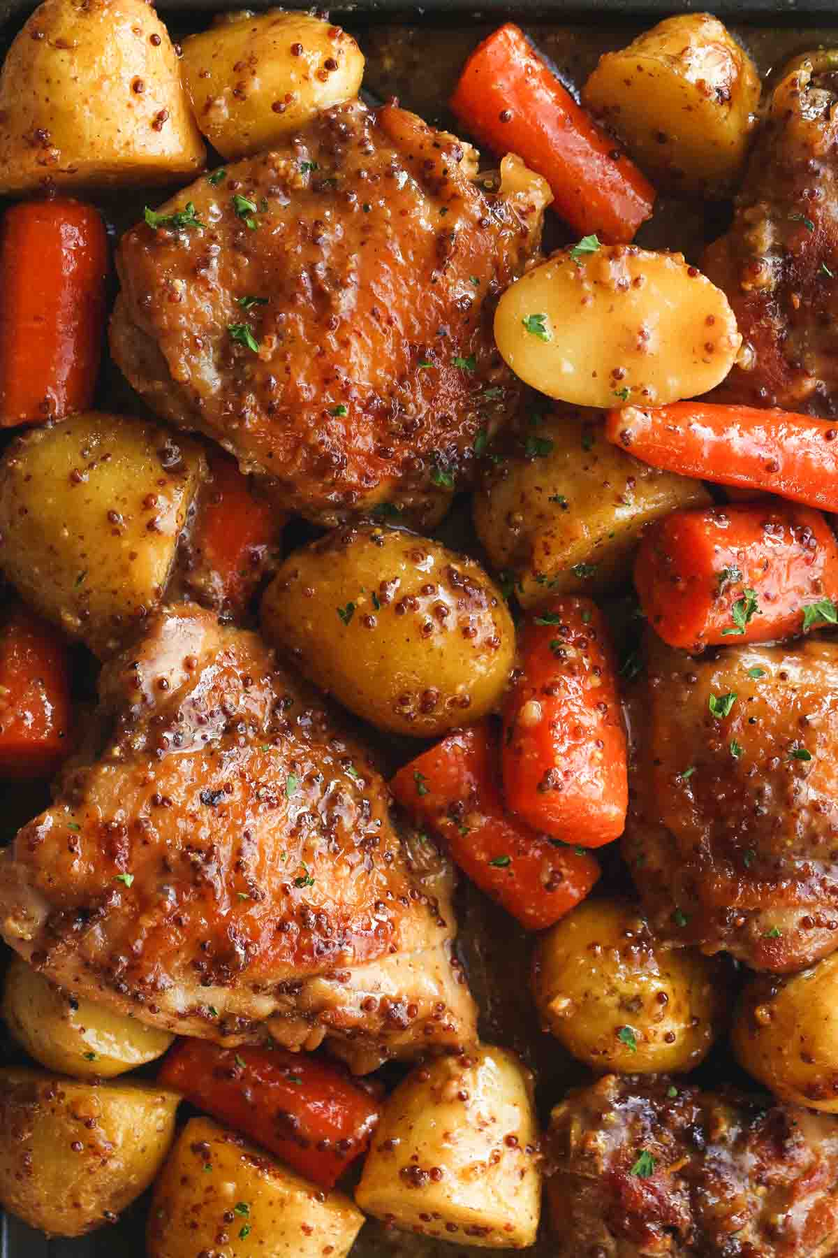 Honey mustard chicken with baby potatoes and carrots, and grainy mustard