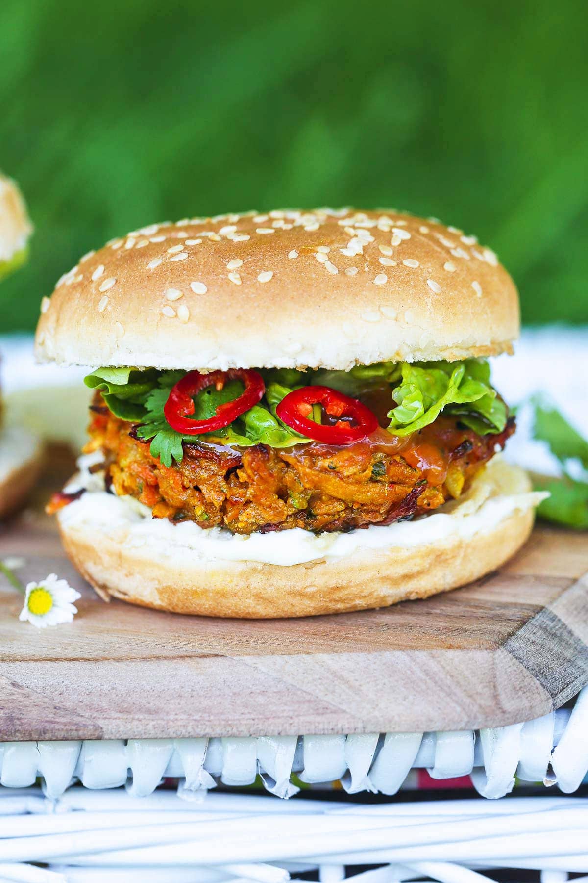 A vegan Bhaji Burger on a wooden cutting board