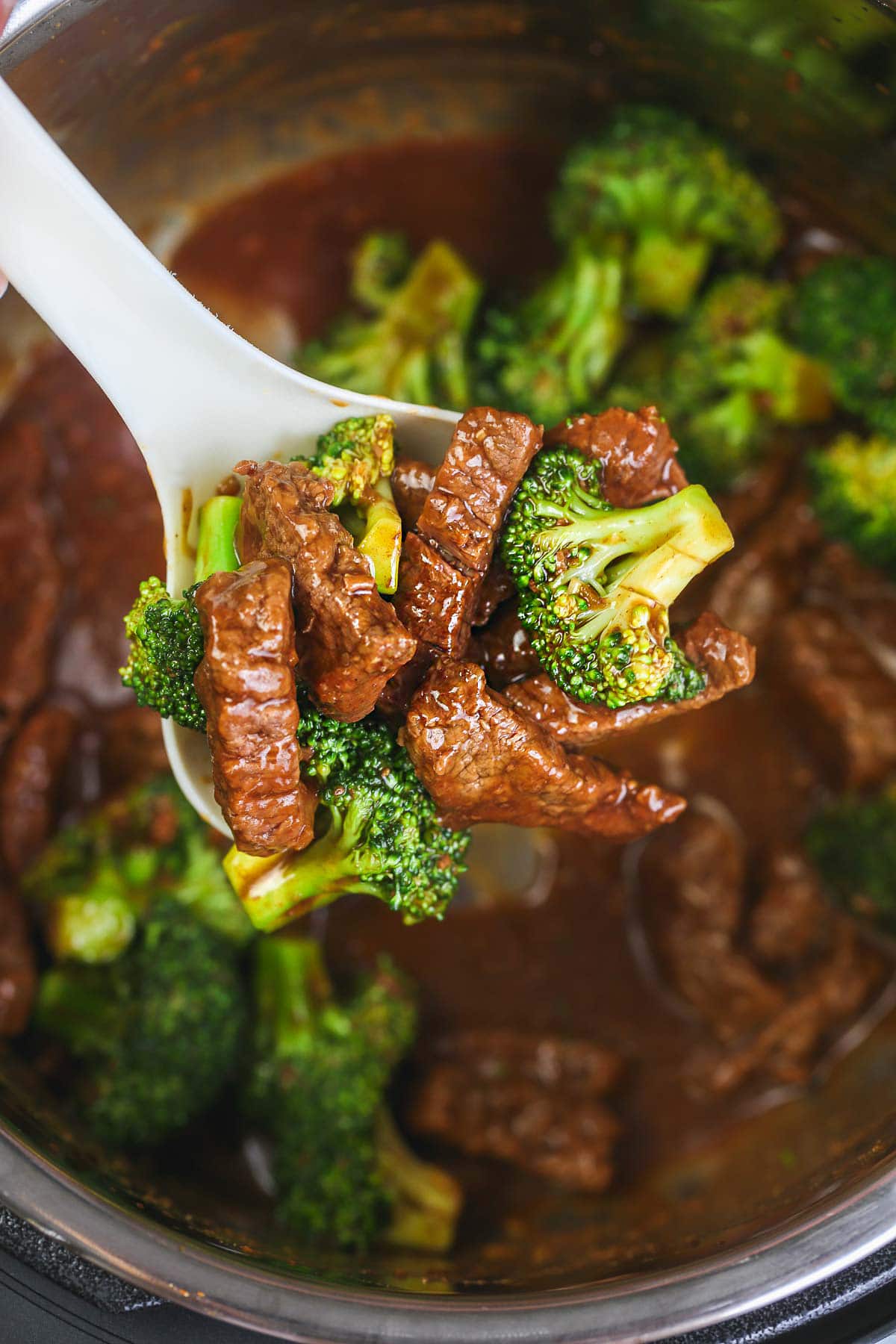 Instant Pot Beef and Broccoli on a serving spoon