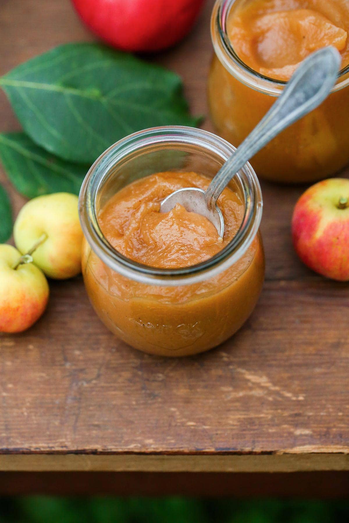 Apple Butter in a small Weck jar, and a spoon.
