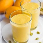 Mango lassi served in transparent glasses