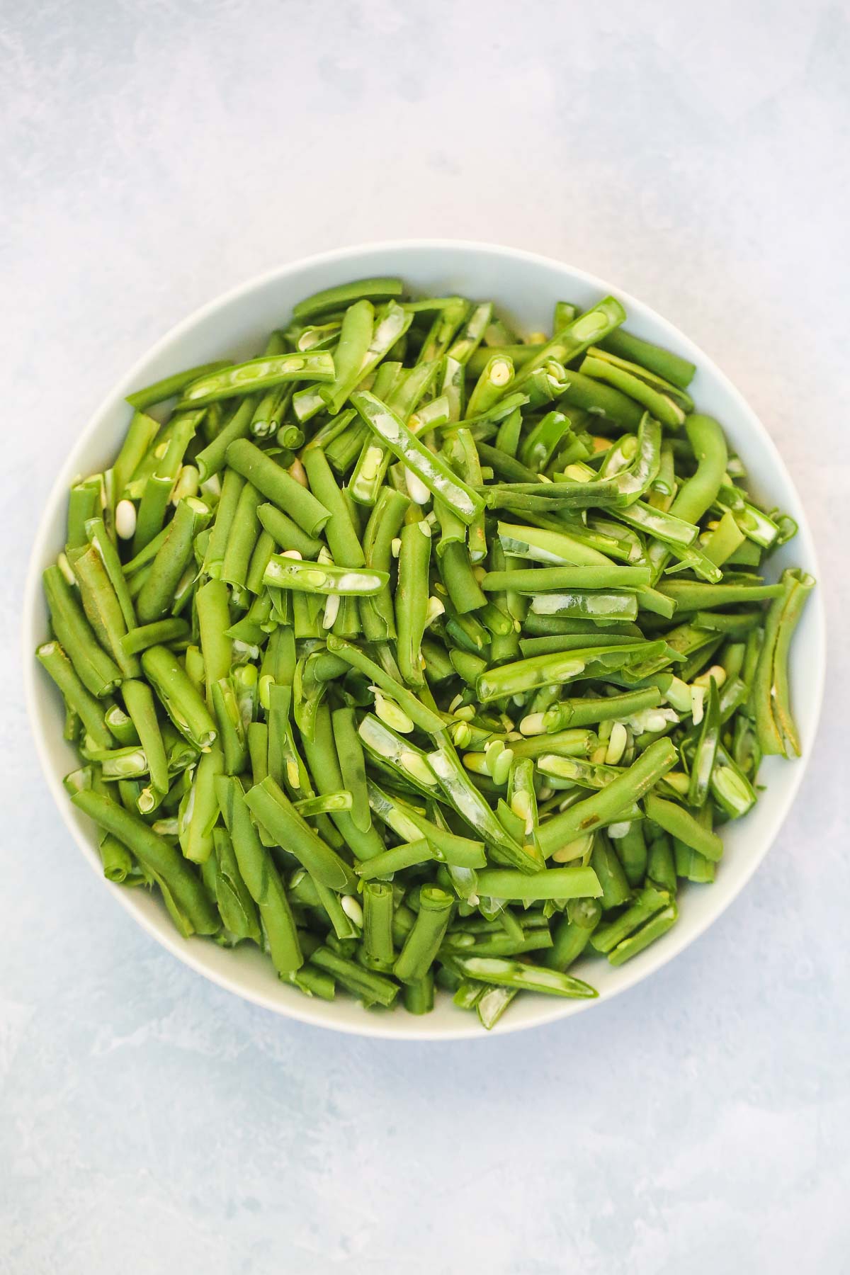 Sliced green beans in a white bowl