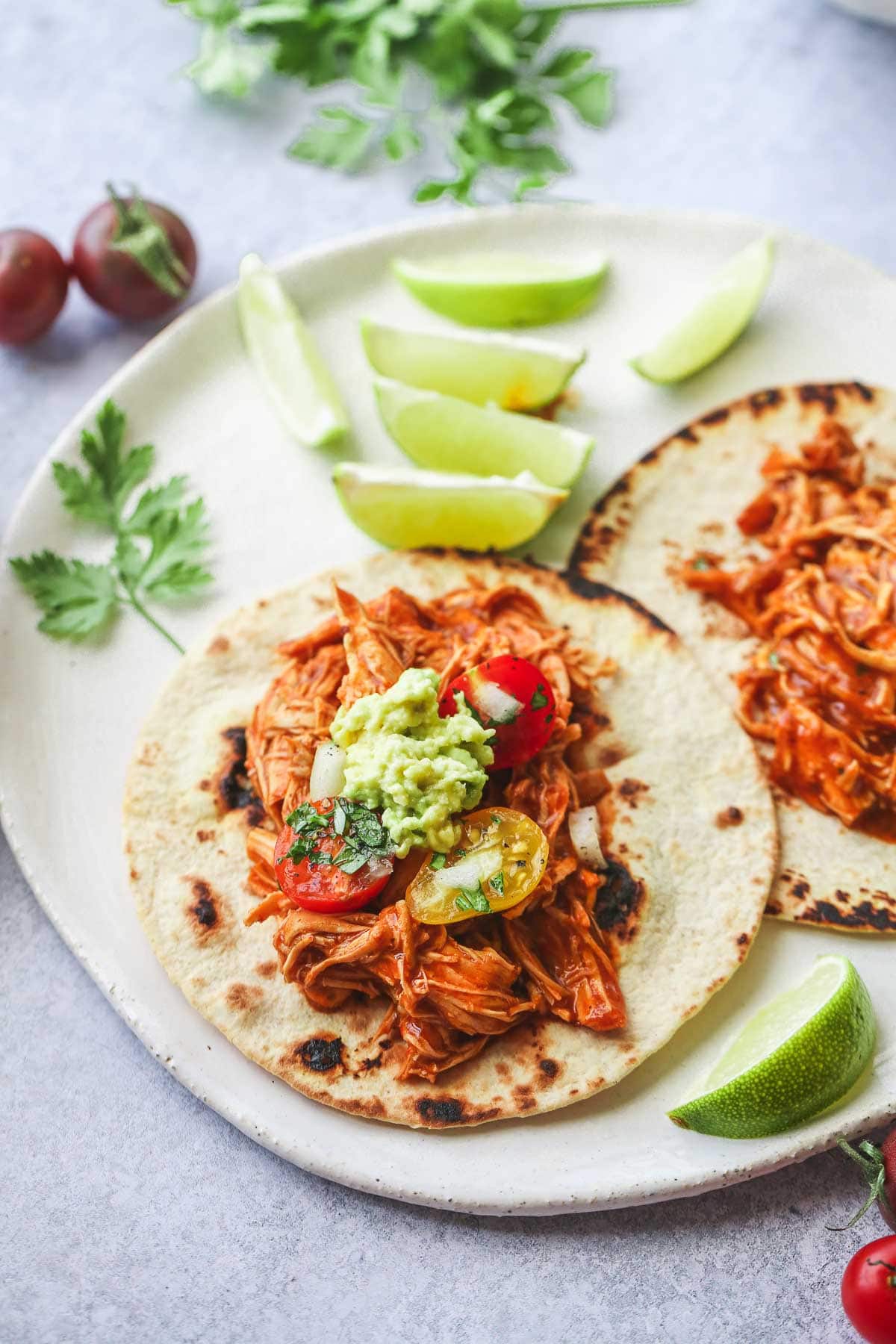 Taco filled with shredded salsa chicken made in the instant pot