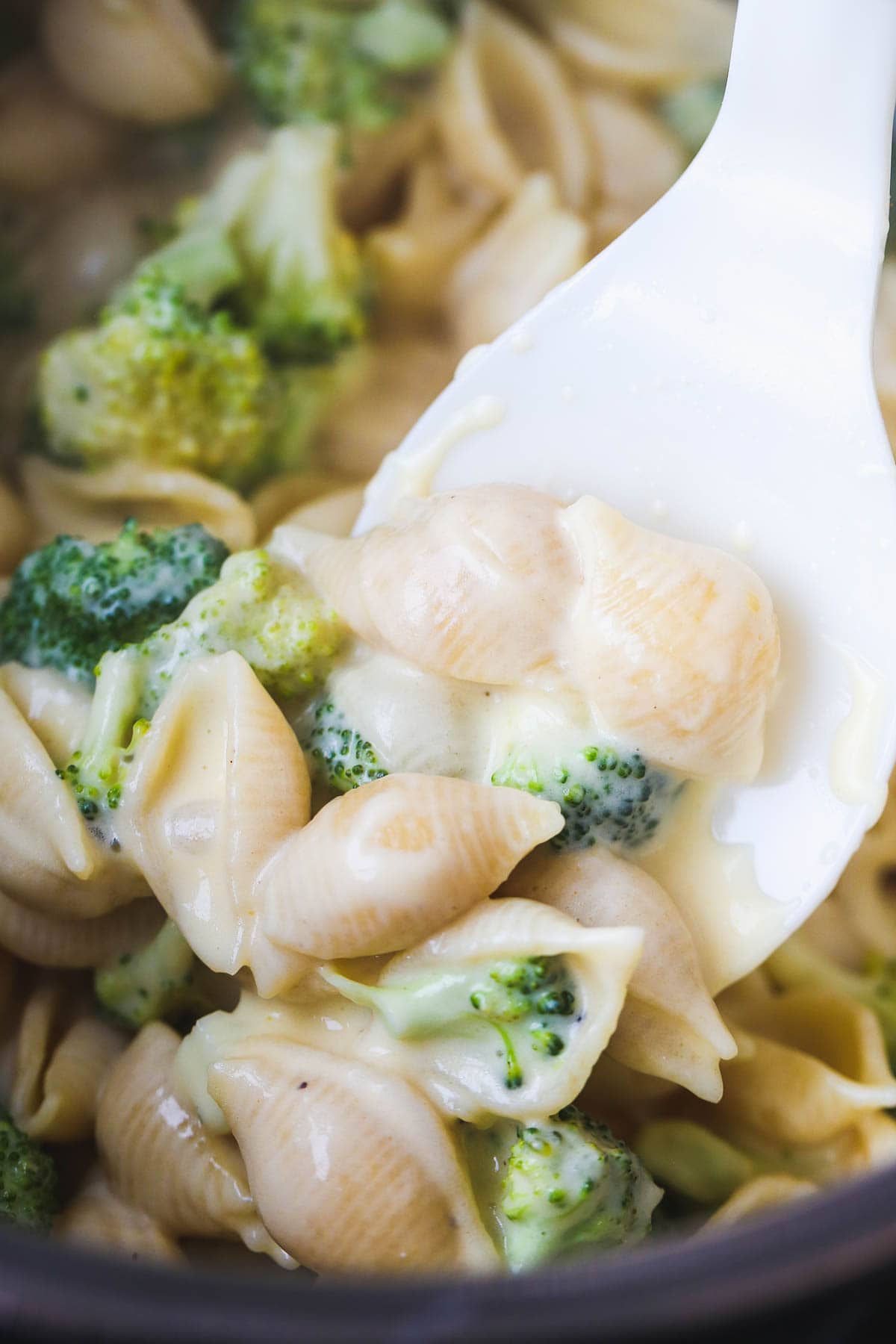 A spoonful of Instant Pot Broccoli Mac and Cheese