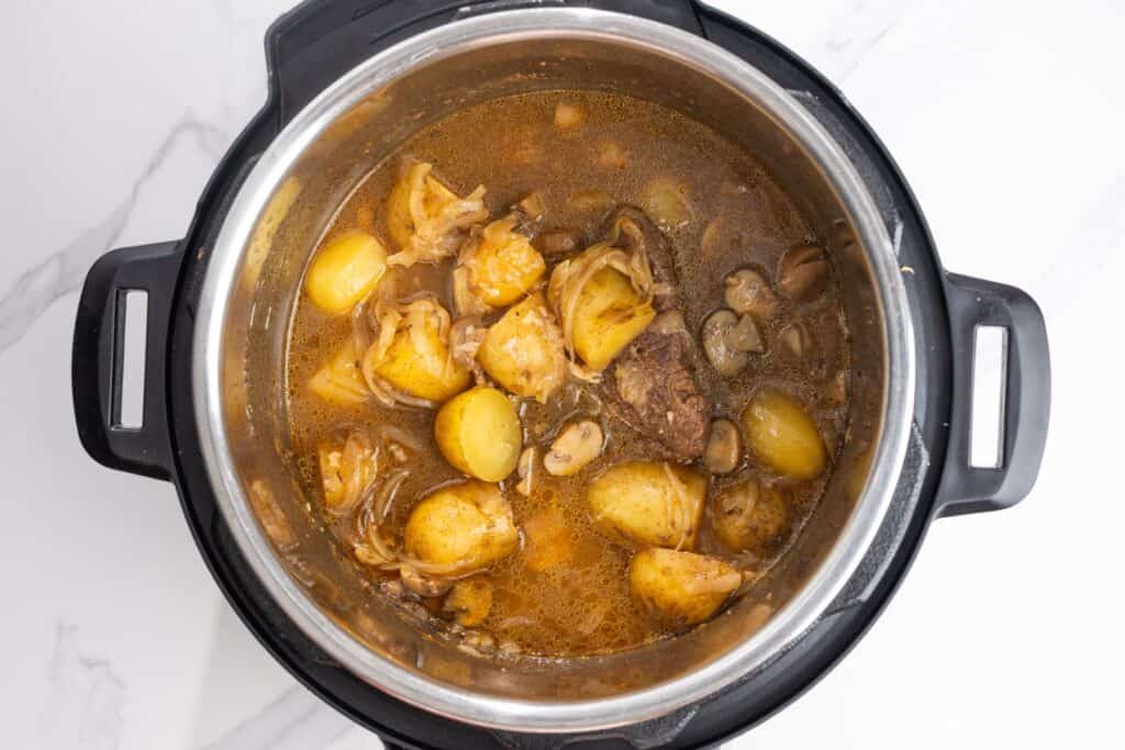 Pressure cooked cube steak, potatoes, mushrooms, and onions in the Instant Pot before thickening the gravy.