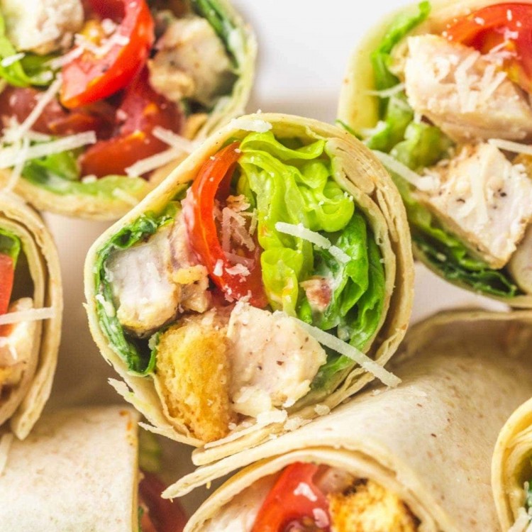Caesar chicken wraps stacked on each other