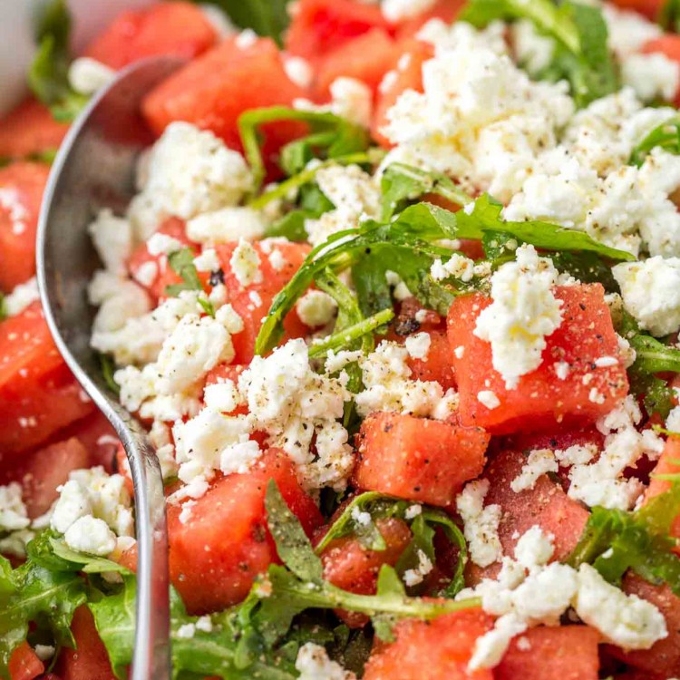 Watermelon and Feta Salad in a large serving bowl with a serving spoon