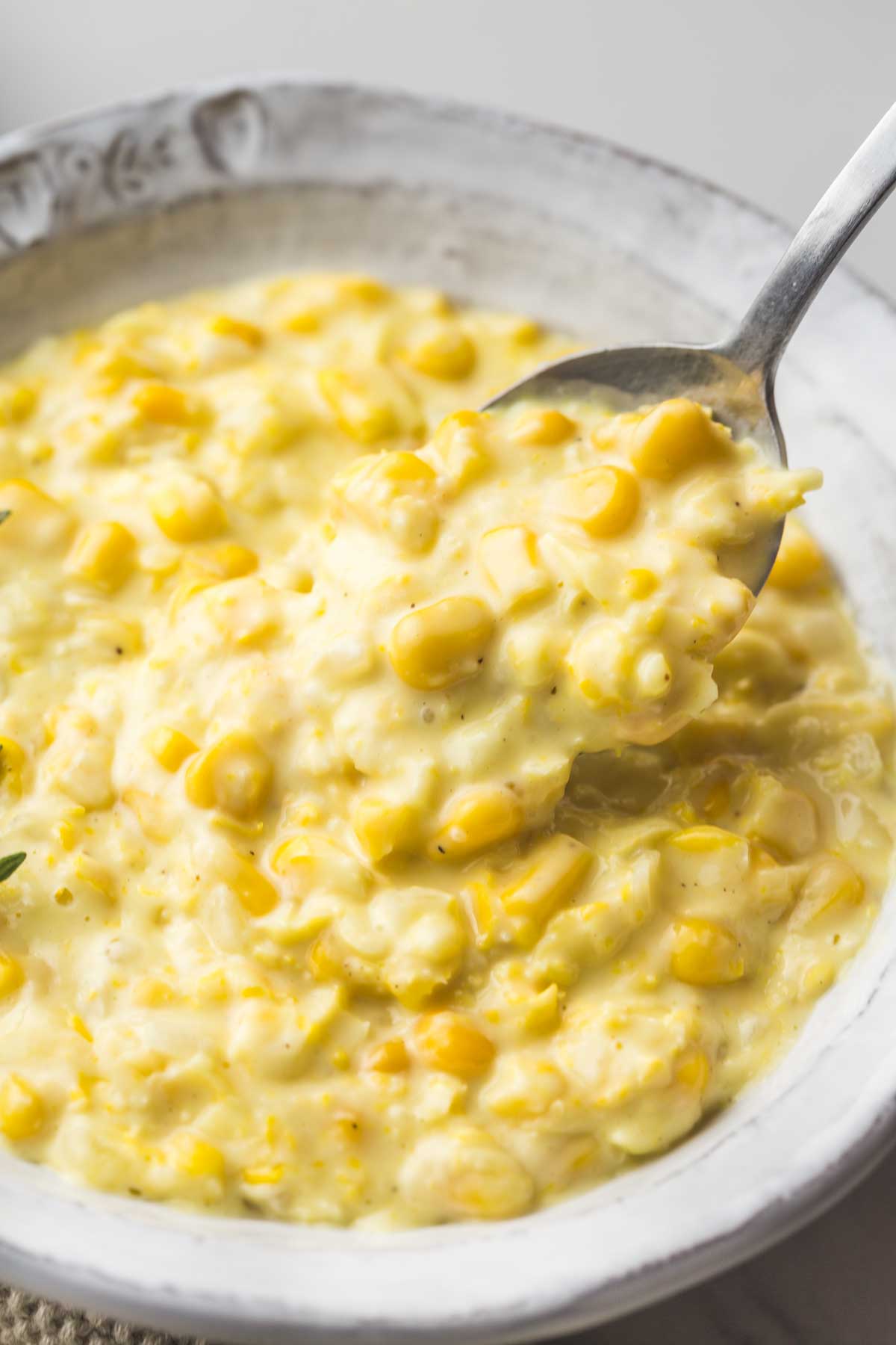 Creamed corn in a gray bowl
