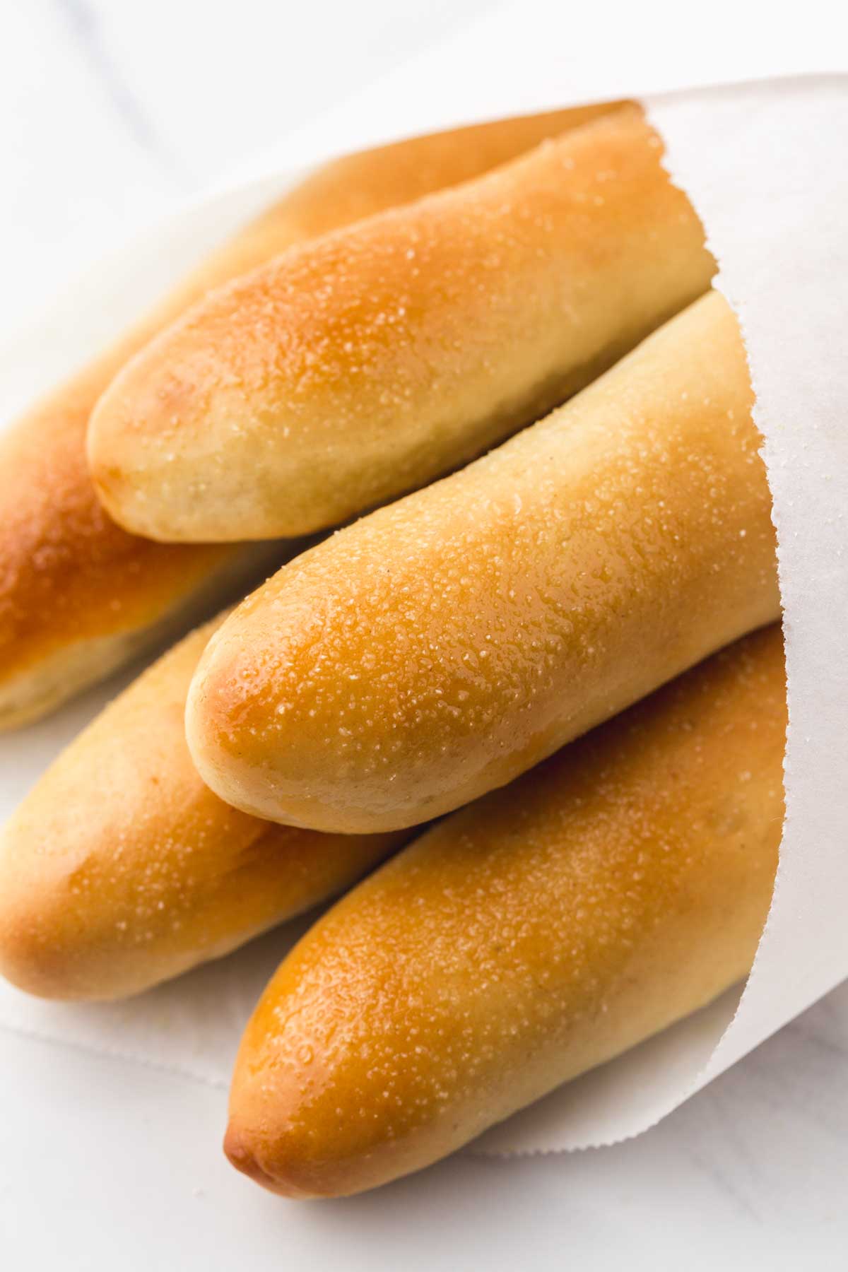 Close up shot of olive garden breadsticks in grease proof paper