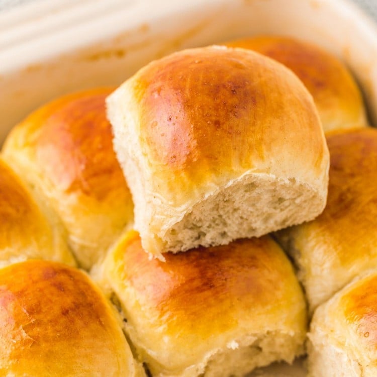 Stacked dinner rolls in a pan