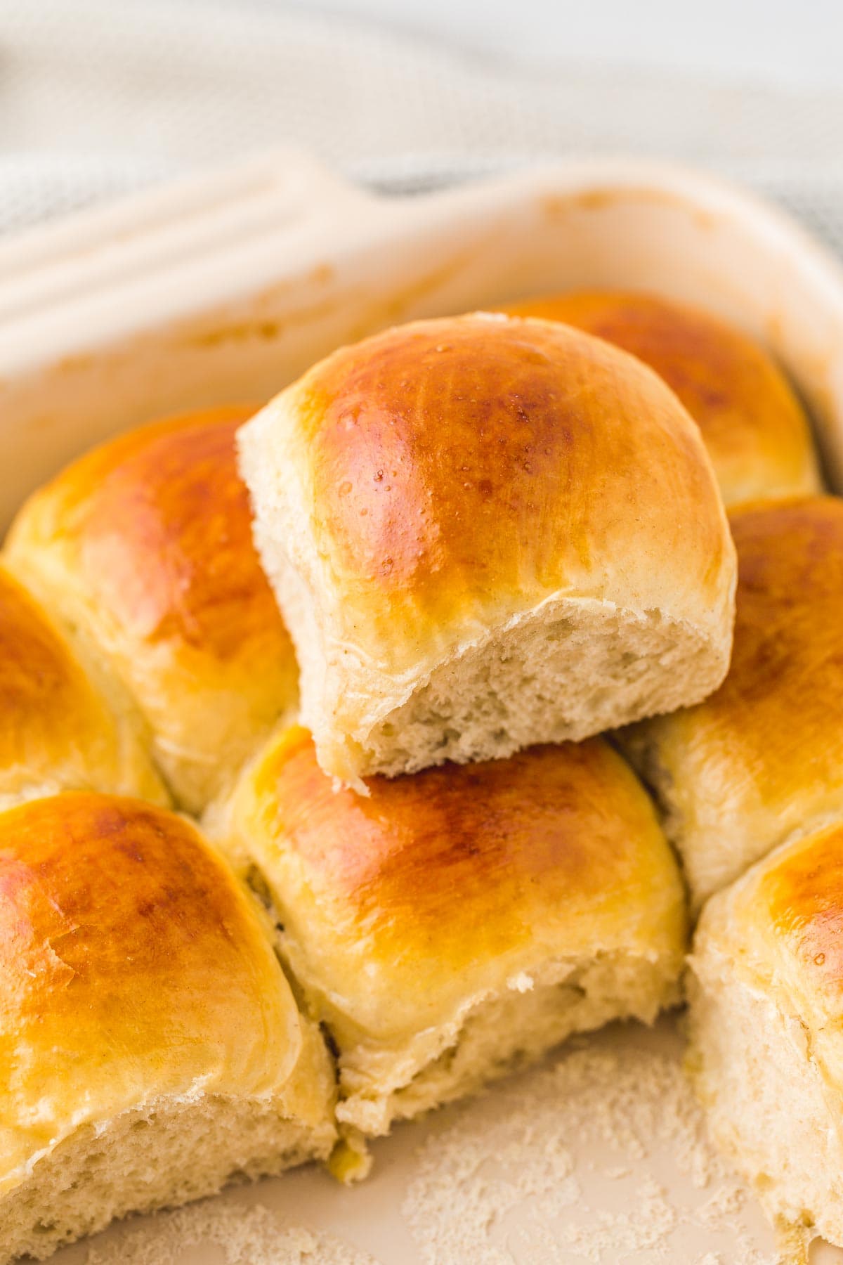 Stacked dinner rolls in a pan