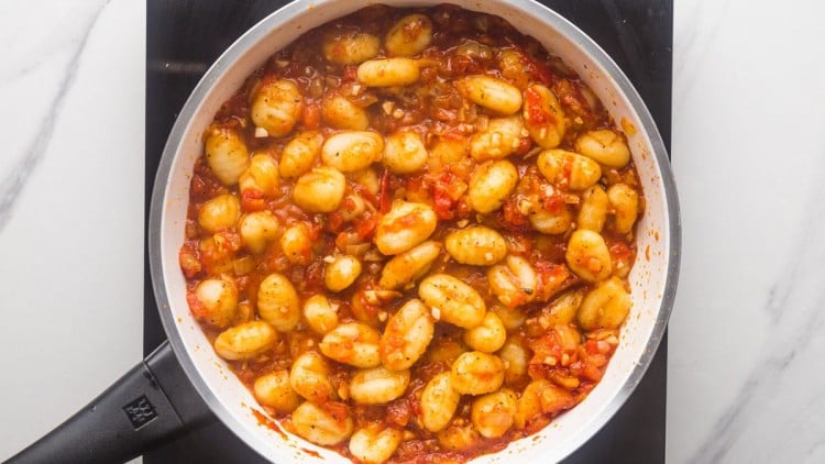 Cooked gnocchi with tomato sauce in a pan