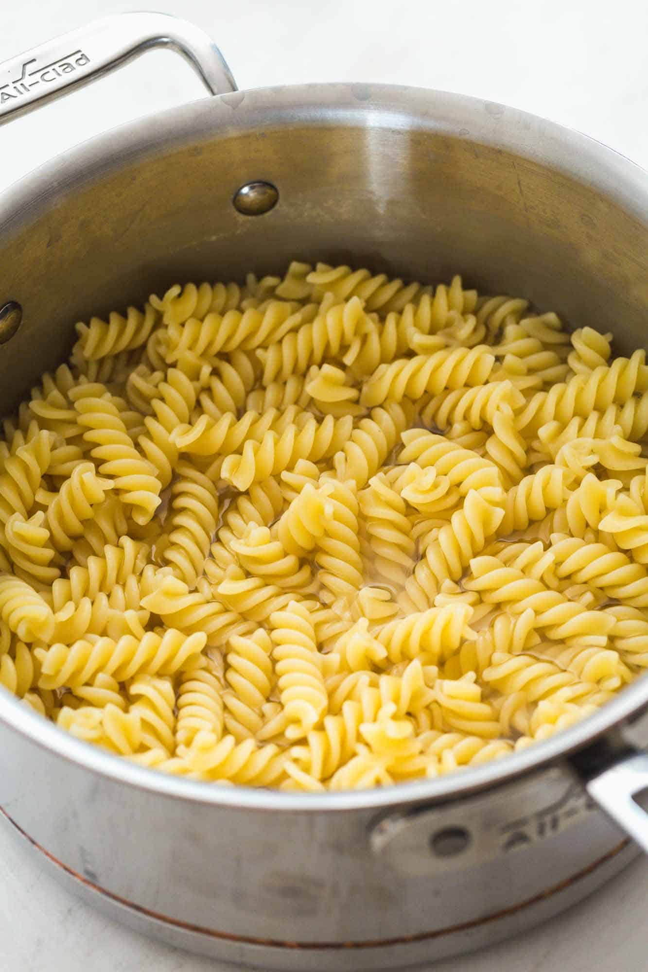 Cooked fusilli pasta in al all clad saucepan