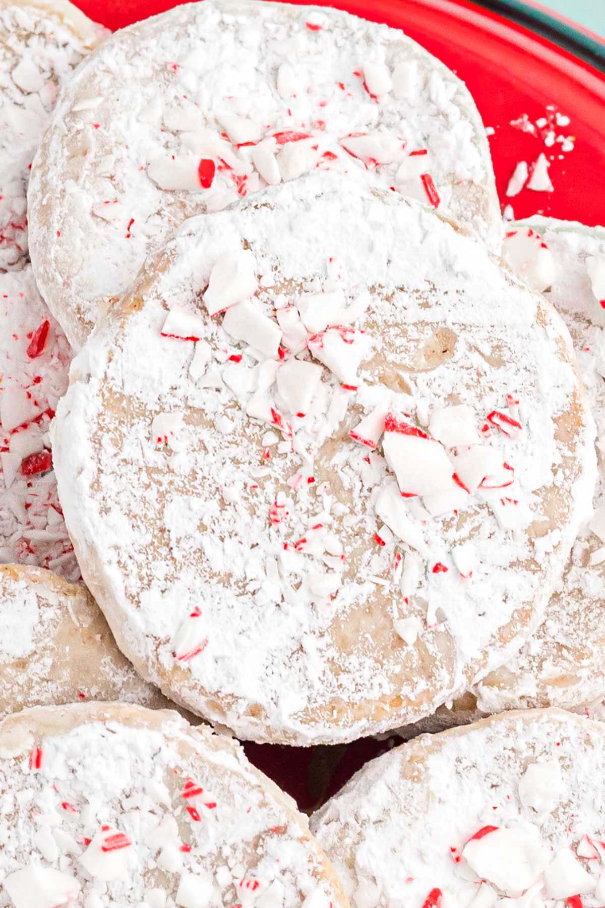 Close up of the spiced cookies with crushed candy cane topping, and powdered sugar
