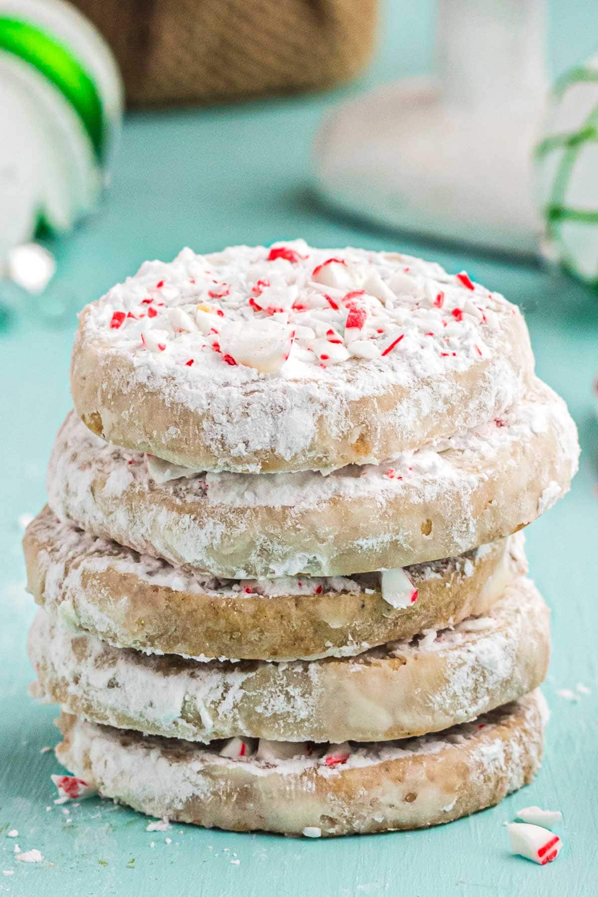 A close up stack of rum cookies with peppermint crushed candy cane topping