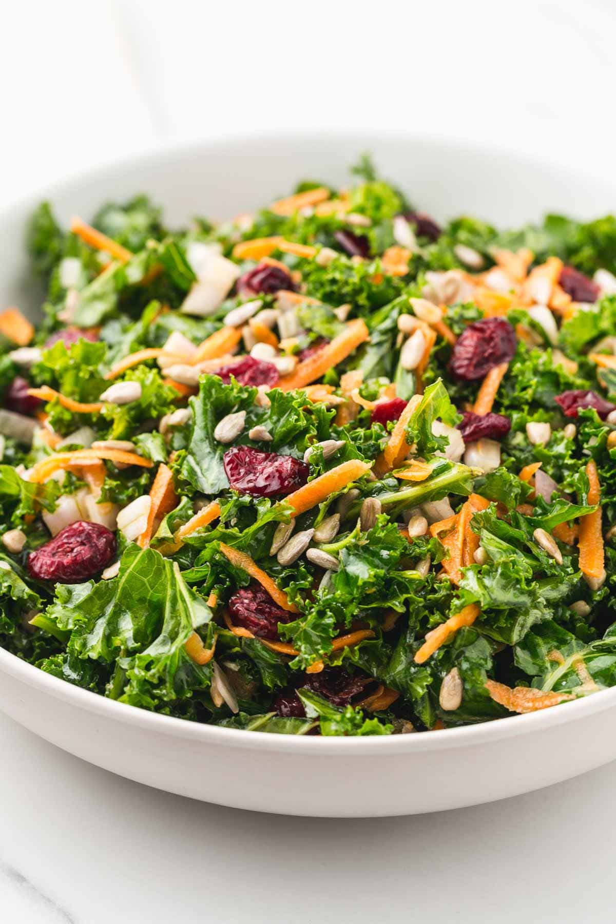 Kale salad in a large white bowl