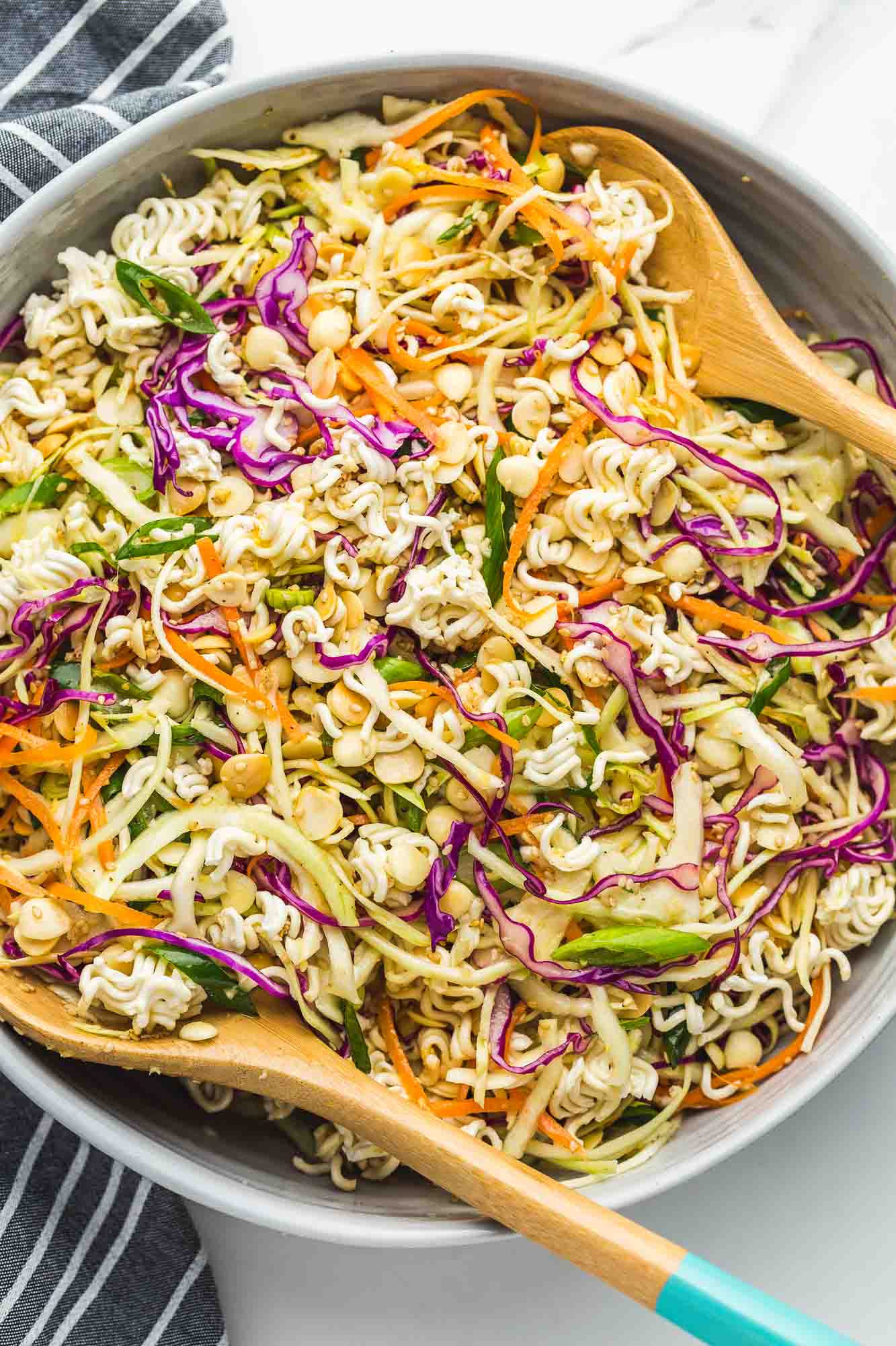 Ramen Noodle Salad in a large gray bowl with wooden serving spoons