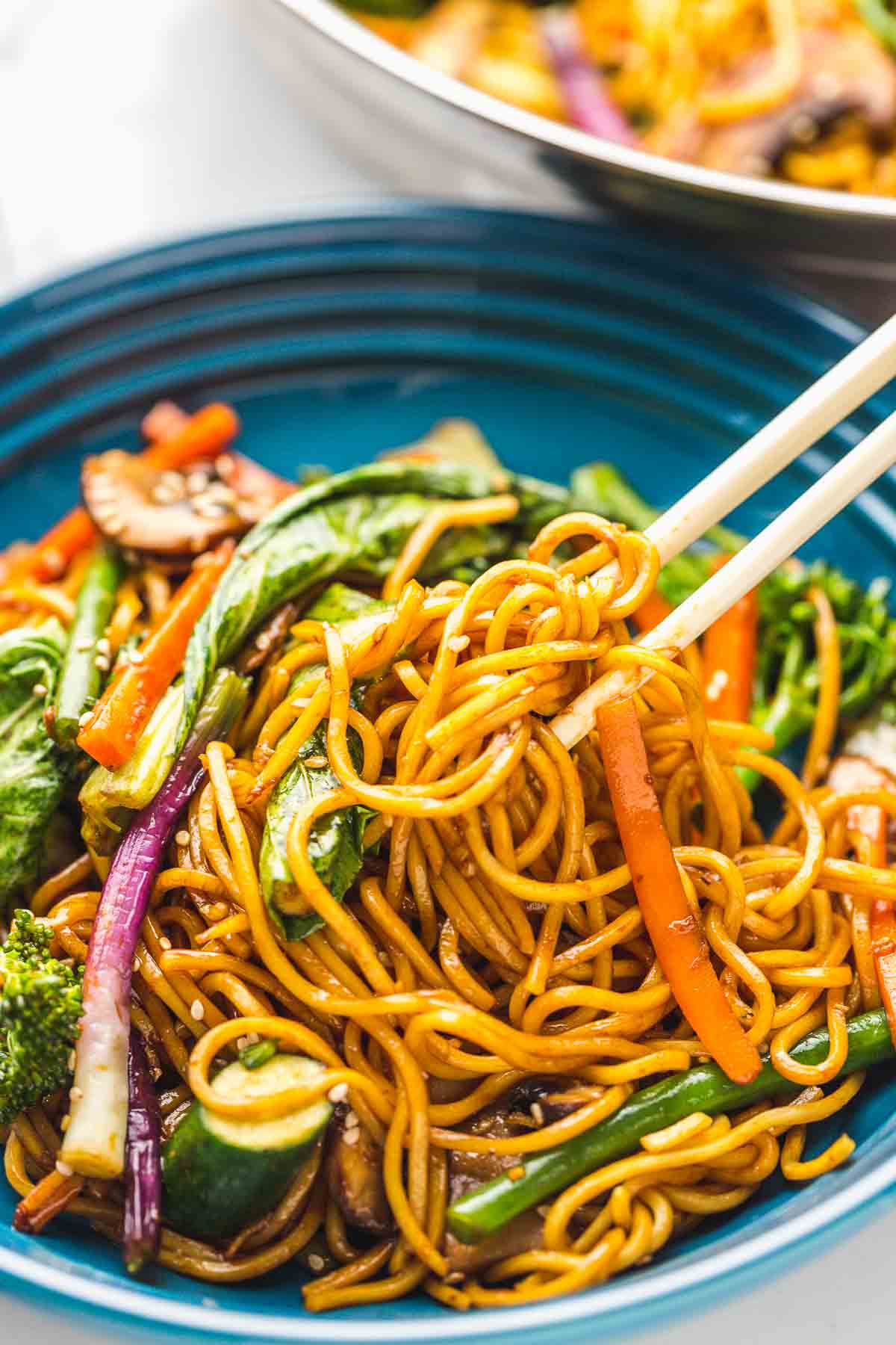 Enjoying the stir fry with a pair of chopsticks. 