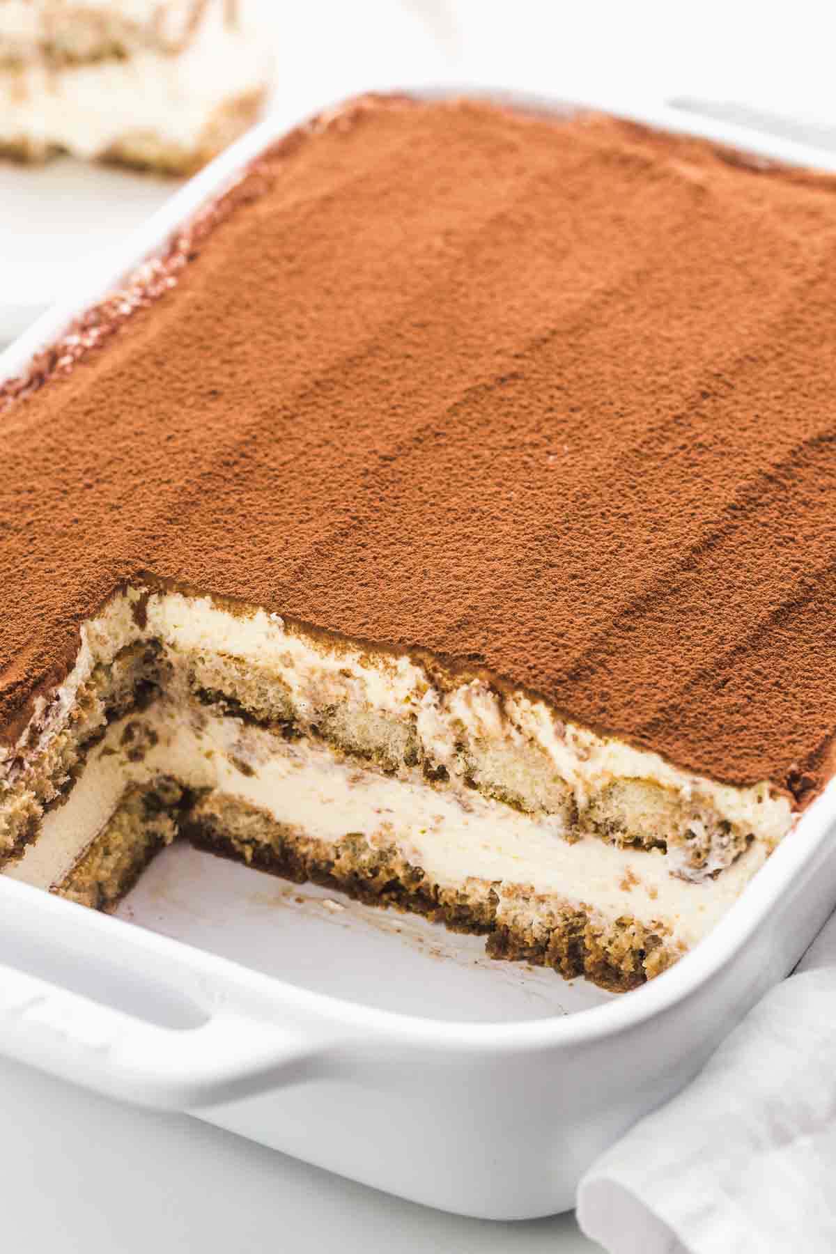 Perfect tiramisu in a white casserole dish