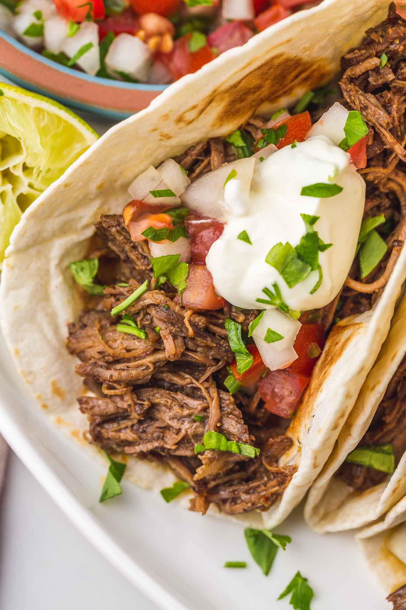 Close up shot of shredded beef taco