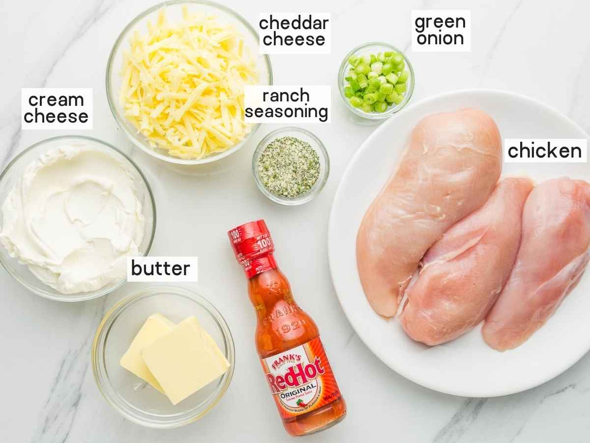 Ingredients needed to make Buffalo chicken dip.