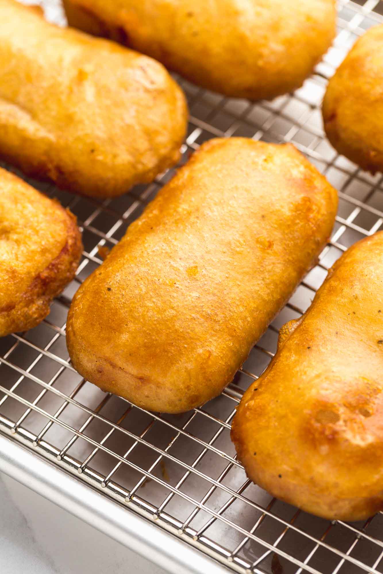 Crispy SPAM® fritters on a cooling wire rack.