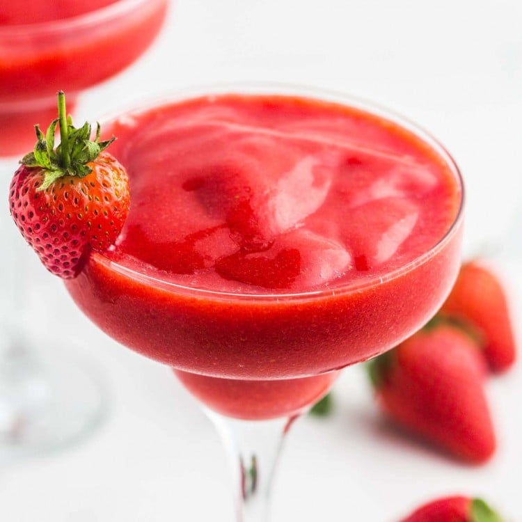 Strawberry Daiquiri in martini glasses, garnished with fresh strawberries