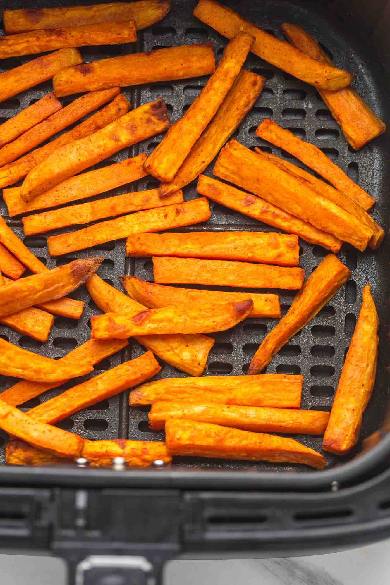 Sweet potato fries in an air fryer basket