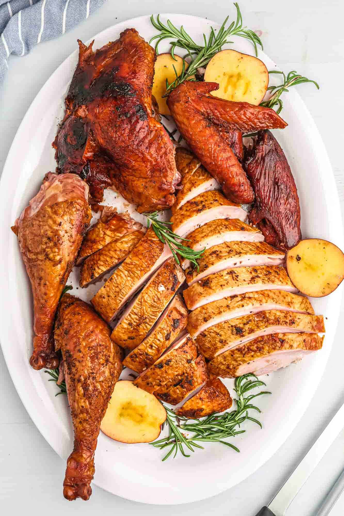 Carved turkey served on a white platter