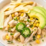 Crockpot White Chicken Chili served in a white bowl with toppings