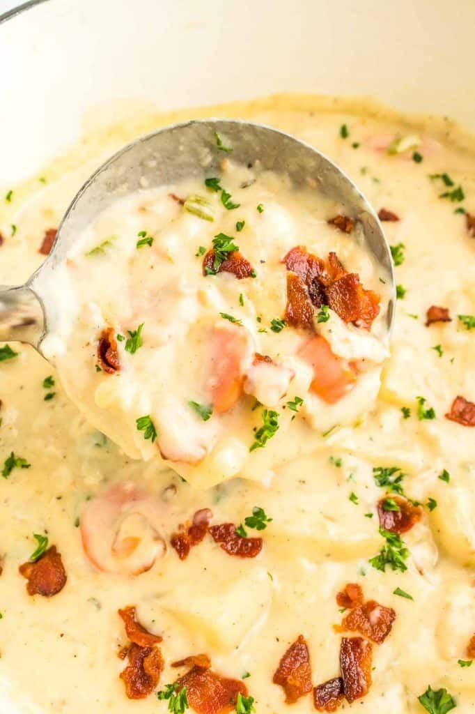 A ladle with clam chowder