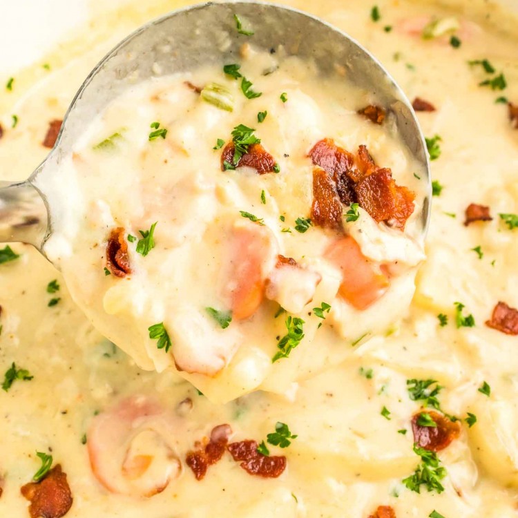 A ladle with clam chowder