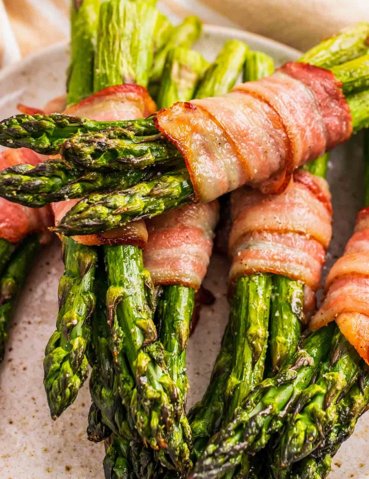 Bacon Wrapped Asparagus stacked on a plate