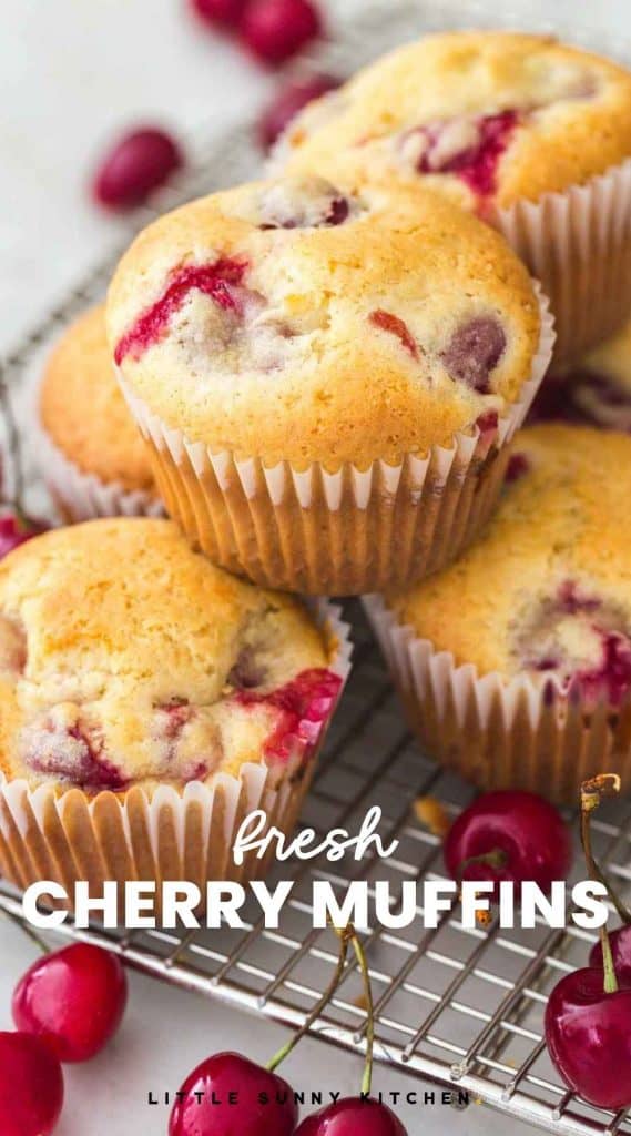 Fresh Cherry Muffins stacked on a wired rack, with an overlay text "fresh cherry muffins"
