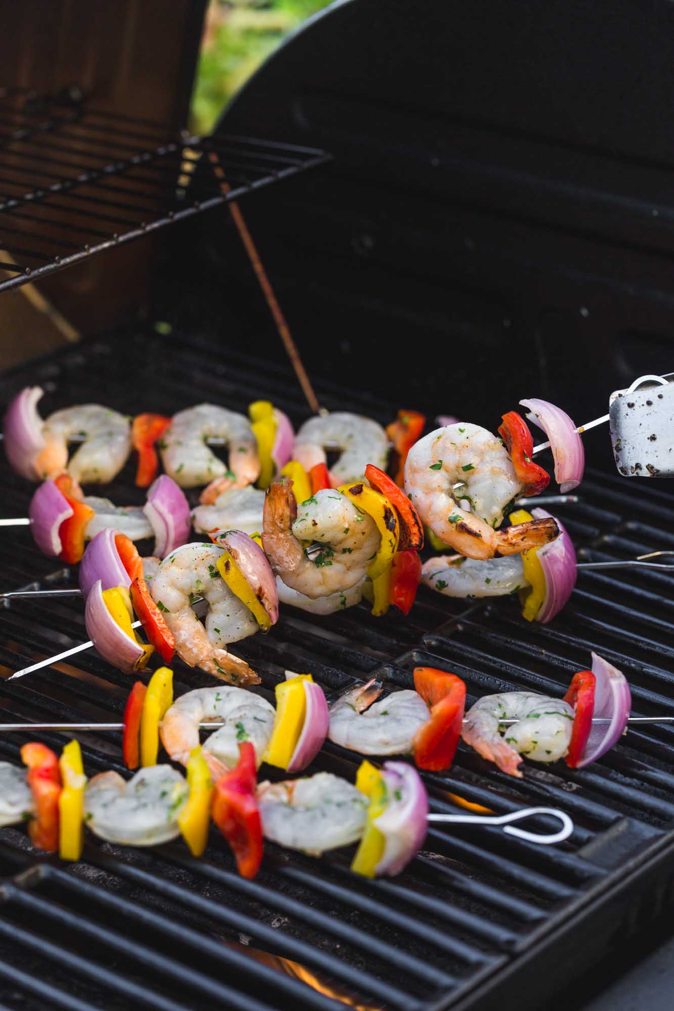 Grilling shrimp kabobs on an outdoor grill