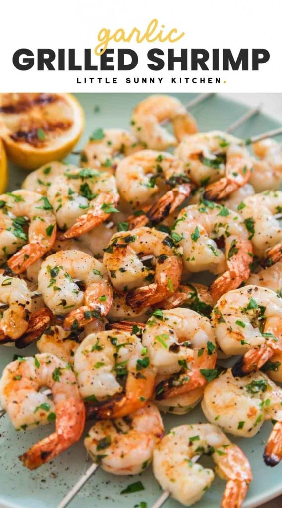 Grilled shrimp on skewers, and overlay text "garlic grilled shrimp"